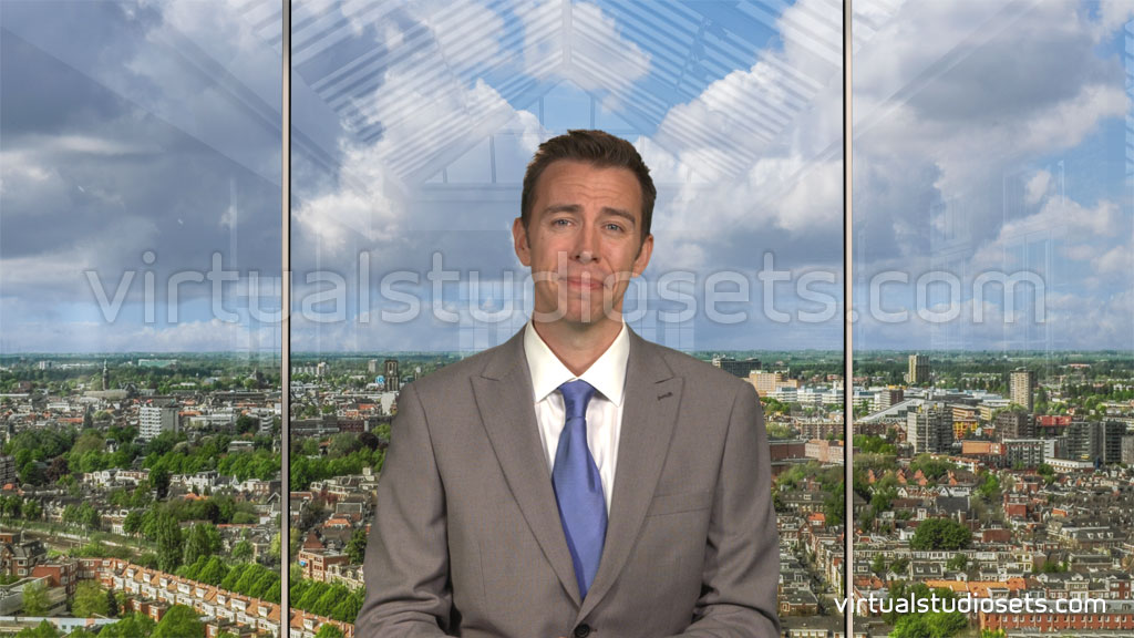 virtual set with a view behind the presenter showing a skyline with weather